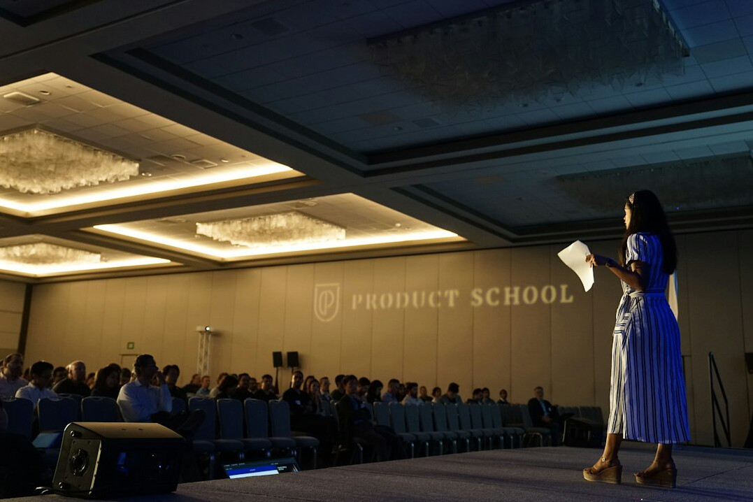 confident speaker presenting to audience