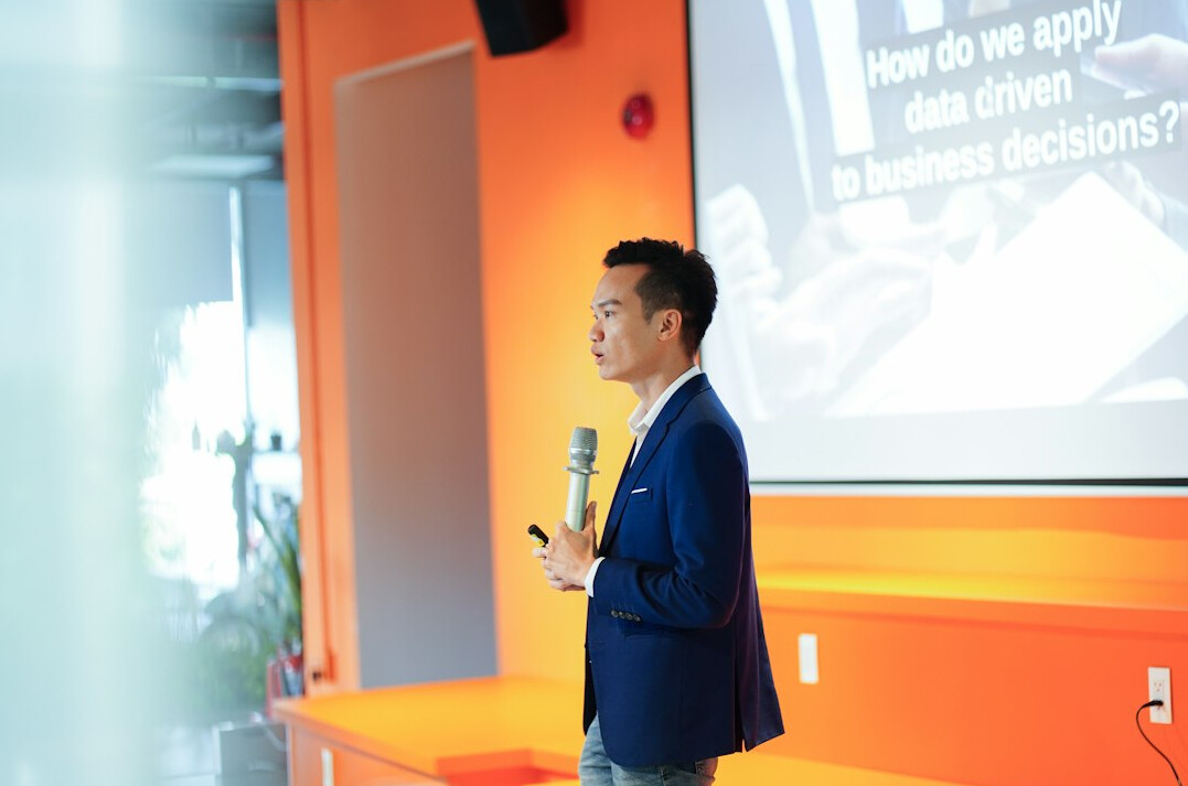 confident speaker presenting to audience