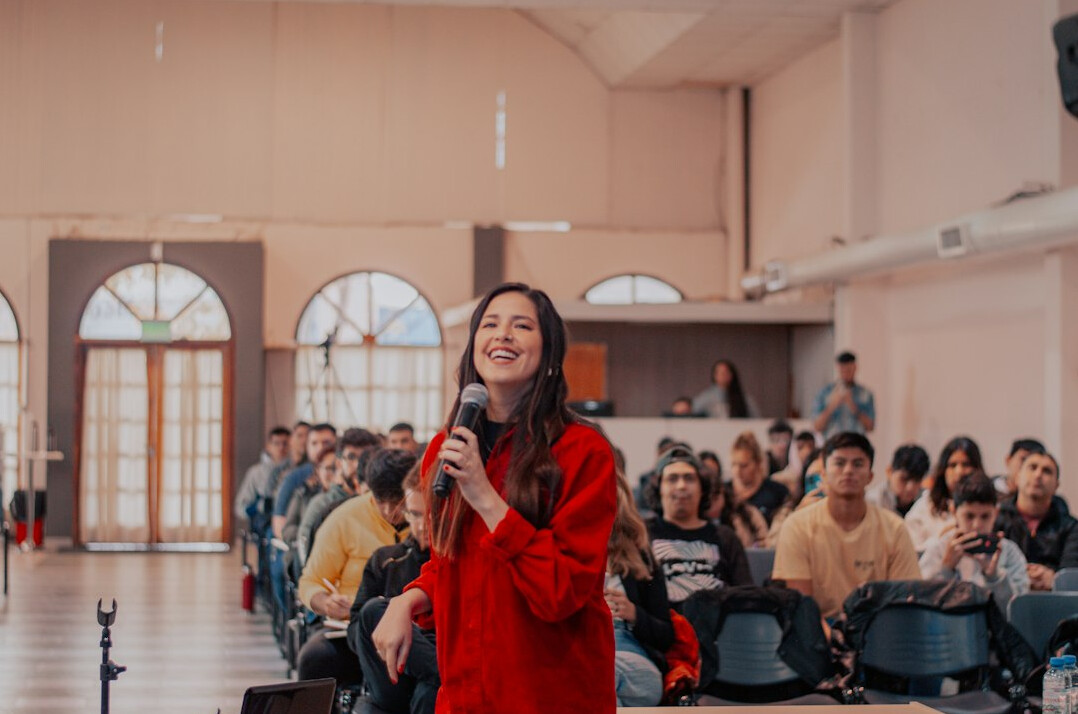 woman speaking confidently on stage